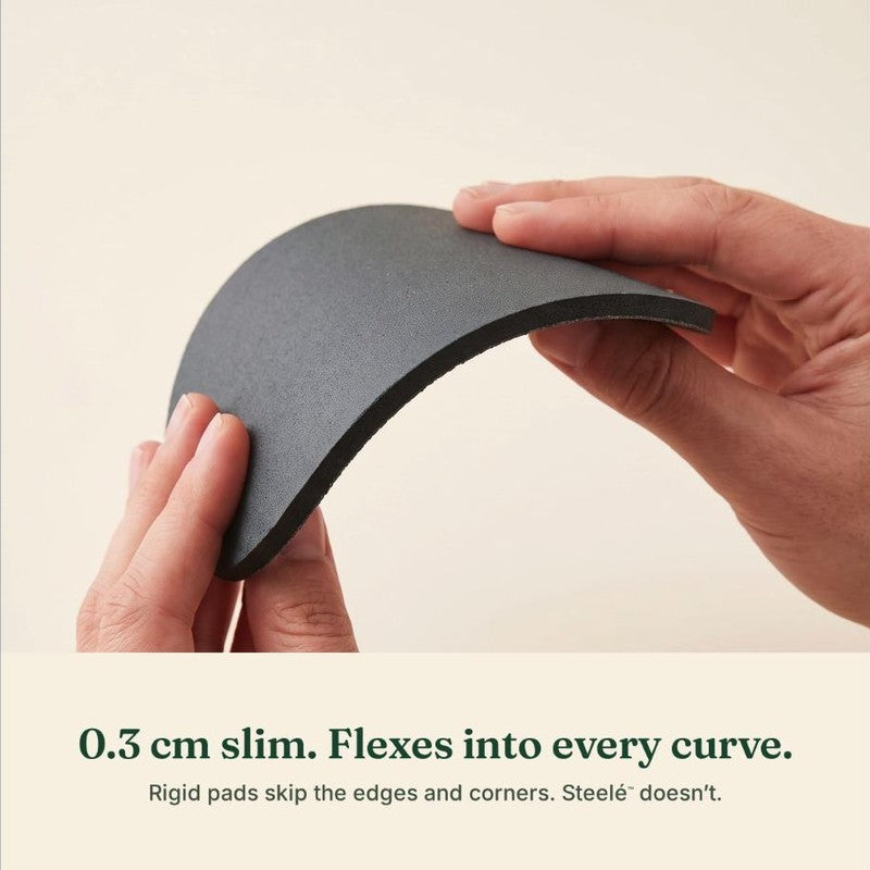 A Steelé disc bent between two fingers, showing its 0.3 cm flexible backing